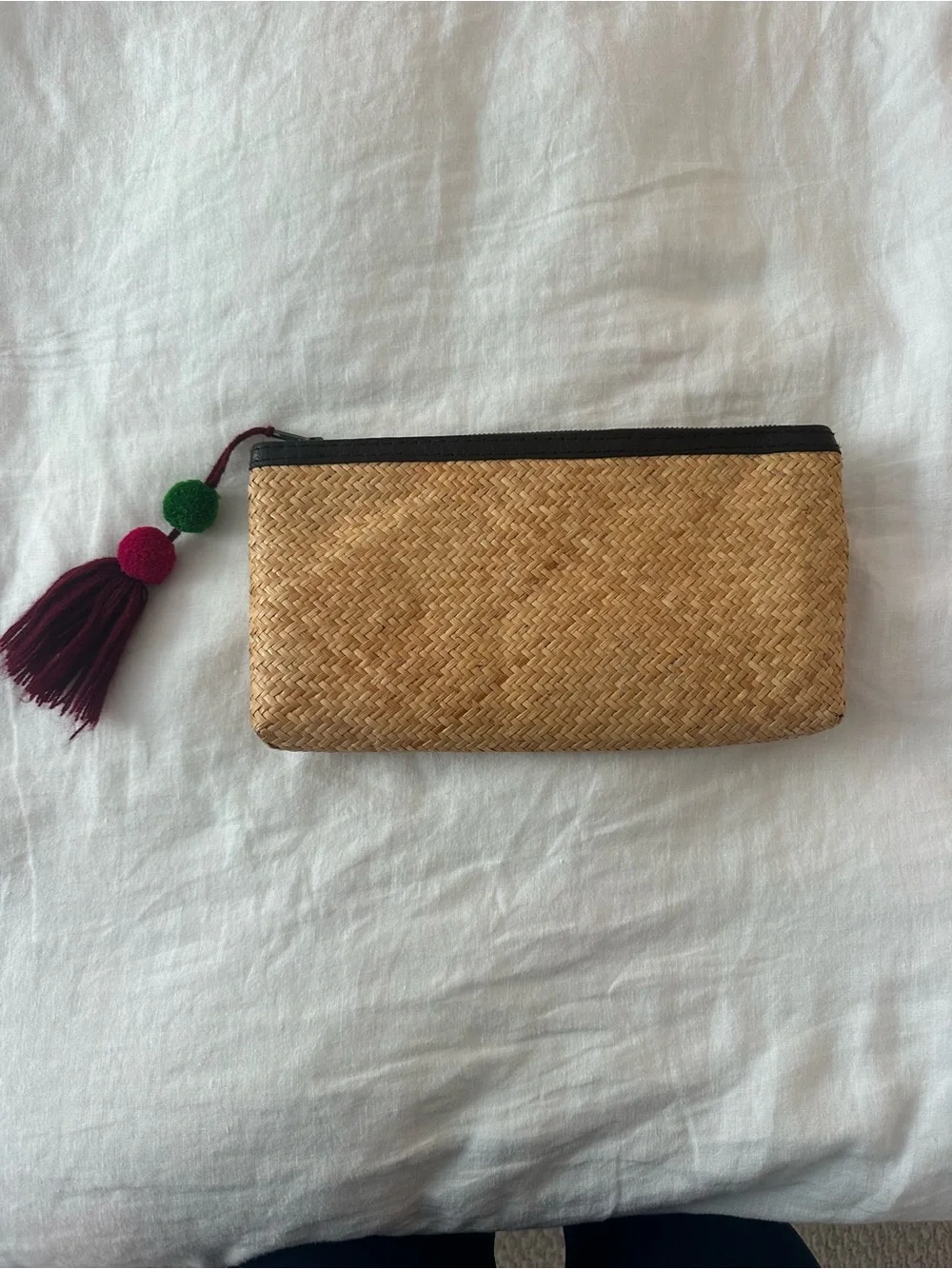 Rattan clutch with pompom zip